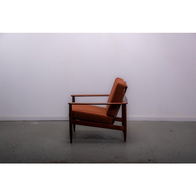 Mid Century easy chair in teak and cane Cushions reupholstered in 100% Wool In very good condition