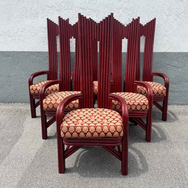 A striking and sculptural set of Postmodern Boho dining chairs, defined by their dramatic high backs composed of vertical...