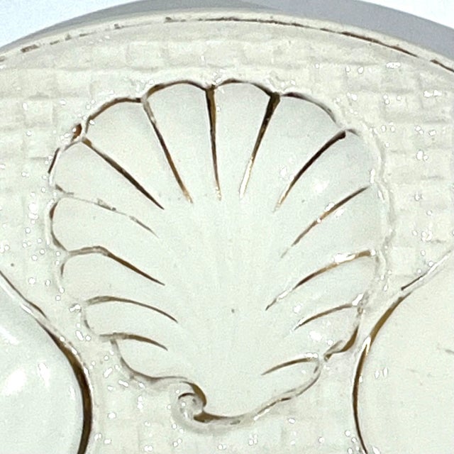 Lovely antique German ivory with gold trim ceramic oyster plate.. Features "basket" weave ground, six oyster wells, and...