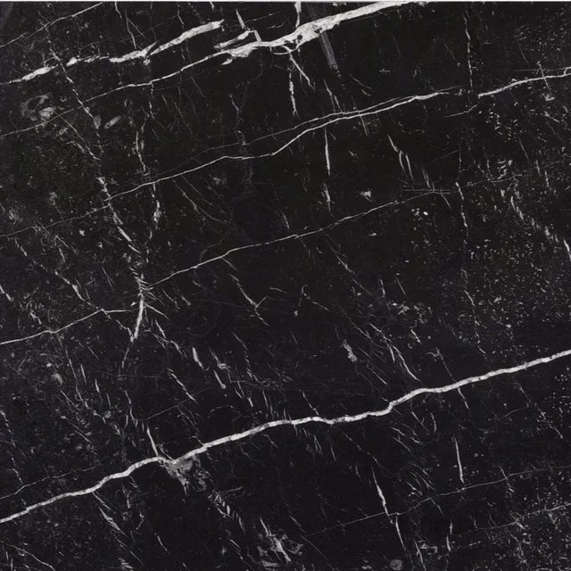 Table in Nero Marquinia marble, made from a single solid block and worked with numerical control machines. Finished by...