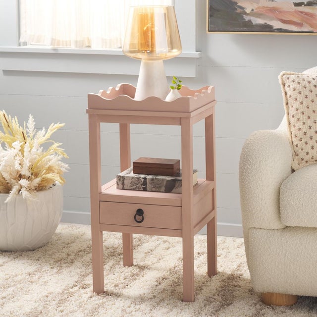 Elevate your space with the Darlyn One Drawer Accent Table in a serene pink color. This versatile piece features a single...