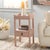 Elevate your space with the Darlyn One Drawer Accent Table in a serene pink color. This versatile piece features a single...