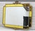 An Italian giltwood wall mirror with a canary‑yellow glass border, in the Rococo Revival style, circa mid‑20th century,...