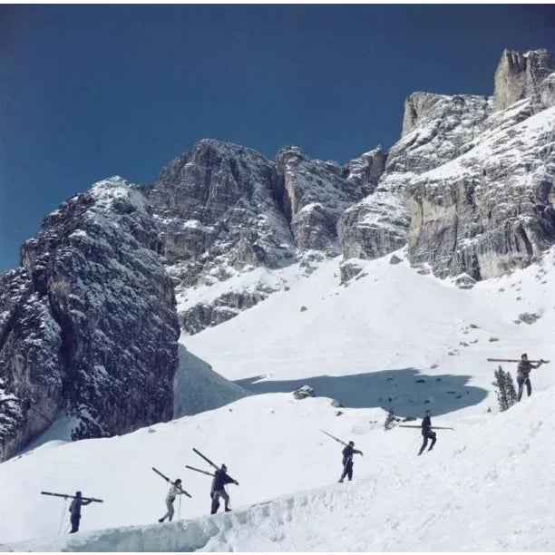 Cortina D’Ampezzo 1962 Skiers walk up a mountain in Cortina D’Ampezzo, a ski resort in northern Italy, 1962. Slim Aarons...