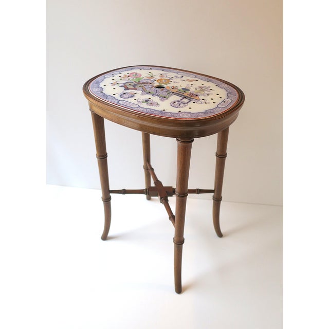 A refined, relatively small, English faux-bamboo mahogany wood side accent table with porcelain top, Chinoiserie-...