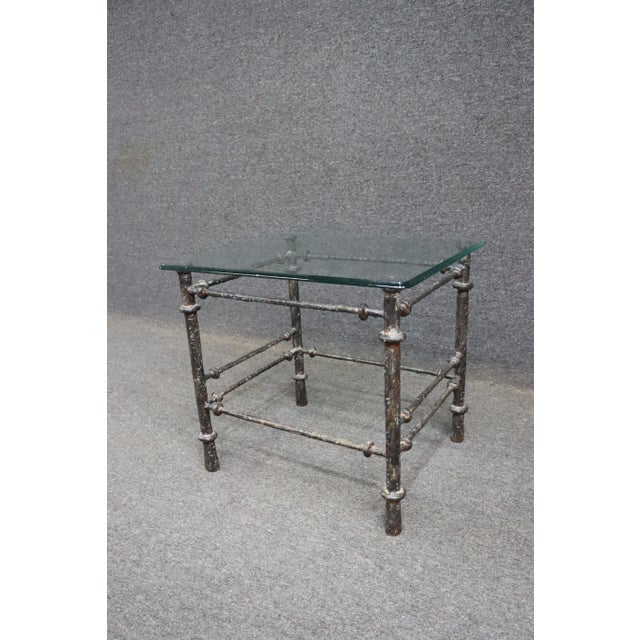Bronze & Iron side table with twig like design/texture and glass top.