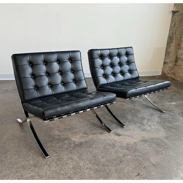 Early pair of iconic Mies Van Der Rohe Barcelona Chairs for Knoll with matching ottomans that were produced in the 1960s...