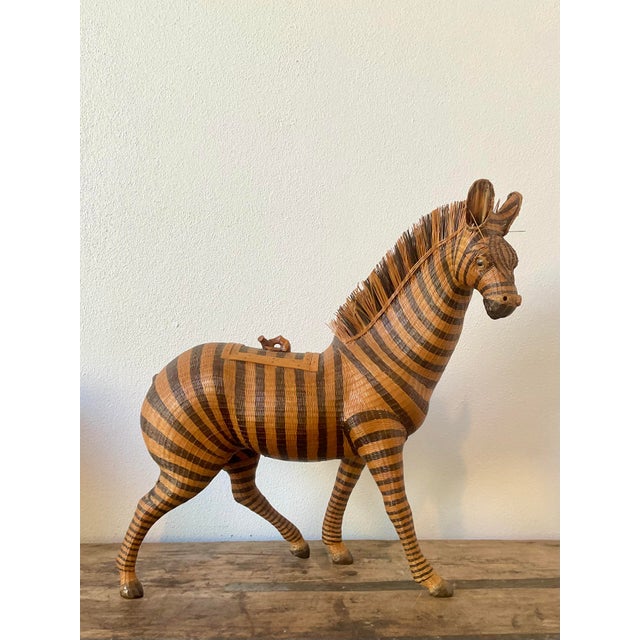 This vintage zebra basket is a striking example of the meticulously detailed "Shanghai weave" technique, a hallmark of...
