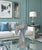 This fluted art glass vase stands 21 inches tall and 10 inches wide, rising in a long, ribbed column that opens into a...