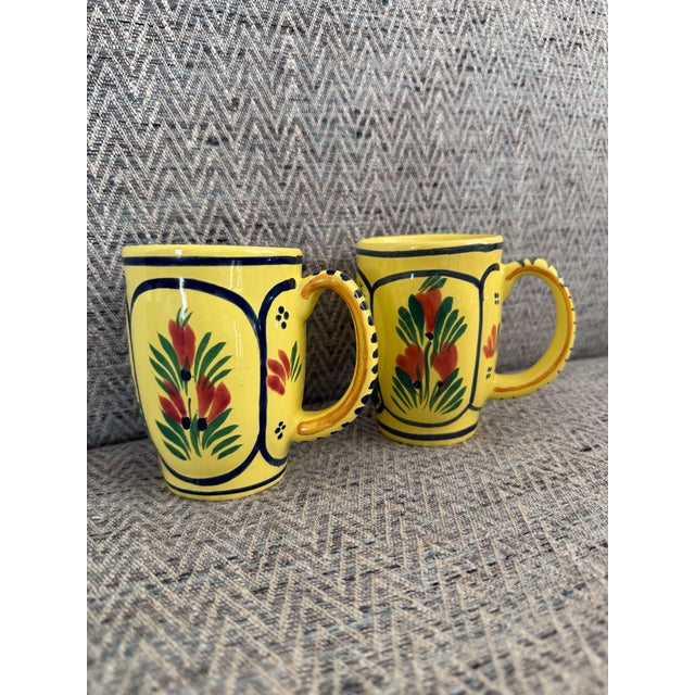 A classic design by Henriot Quimper France, this accent mug in the soleil yellow color features a lady on one side and a...