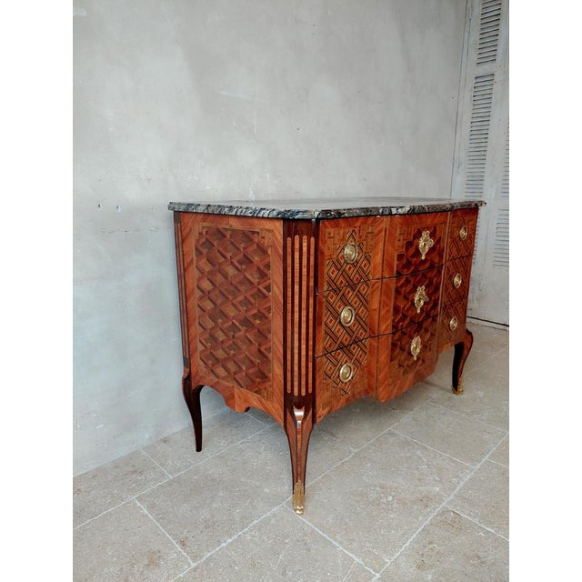 Antique intarsia oak commode with geometric patterns. Transition Louis Seize, Paris, ca. 1770. Stamped / signed under the...