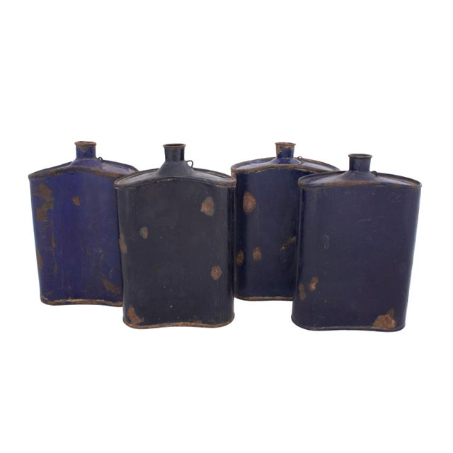 Set of four antique blue enamel canteens Signed "Bengal Enamel 59 CN/IAA/0057". Age wear and some rust; varying shades of...
