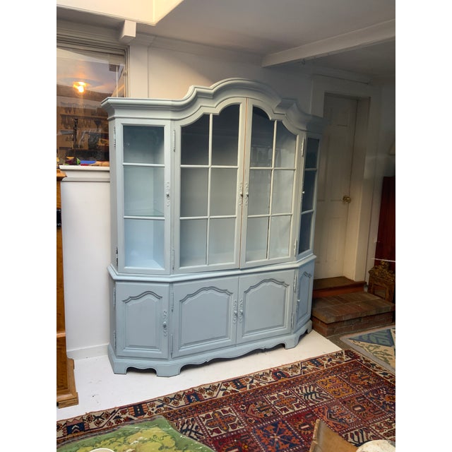 Vintage French Style Four Door Walnut Cabinet.Recently Paint Decorated in Swedish Blue.Four Glass Paneled Doors on Top...