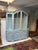 Vintage French Style Four Door Walnut Cabinet.Recently Paint Decorated in Swedish Blue.Four Glass Paneled Doors on Top...
