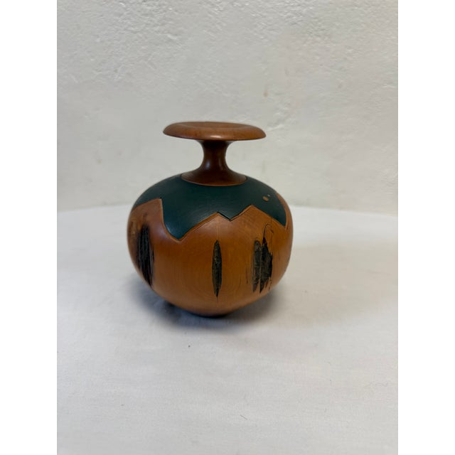 Turned wood vase with a copper and painted accent. Made by Wanderin’ Willy Totara, New Zealand. The model number is A.805.