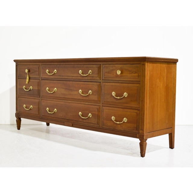 Elevate your home with this handsome Mid Century Transitional Lowboy by Davis Furniture of Nashville TN. Crafted from...