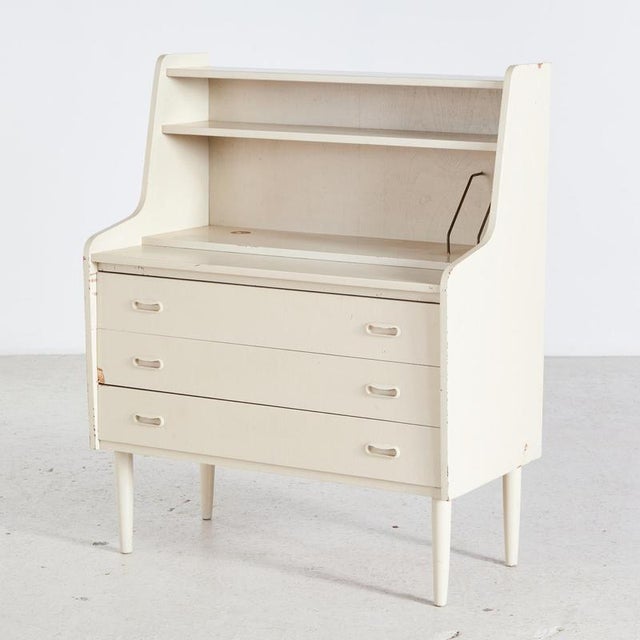 Danish three-drawer white bureau desk with writing board in vintage condition.