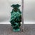 This striking pair of vases features rich, high-relief sculptural decoration in a vibrant turquoise glaze. One vase...