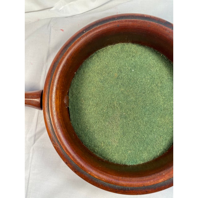 Typical of many of the English churches of the time, this beautiful round mahogany church offertory bowl is both practical...