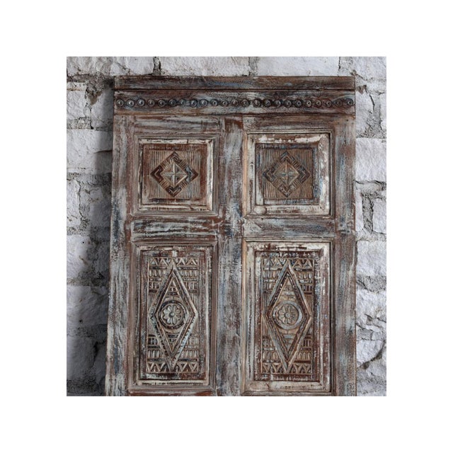 This antique hand-carved French door showcases timeless European-inspired detailing and authentic old-world craftsmanship....