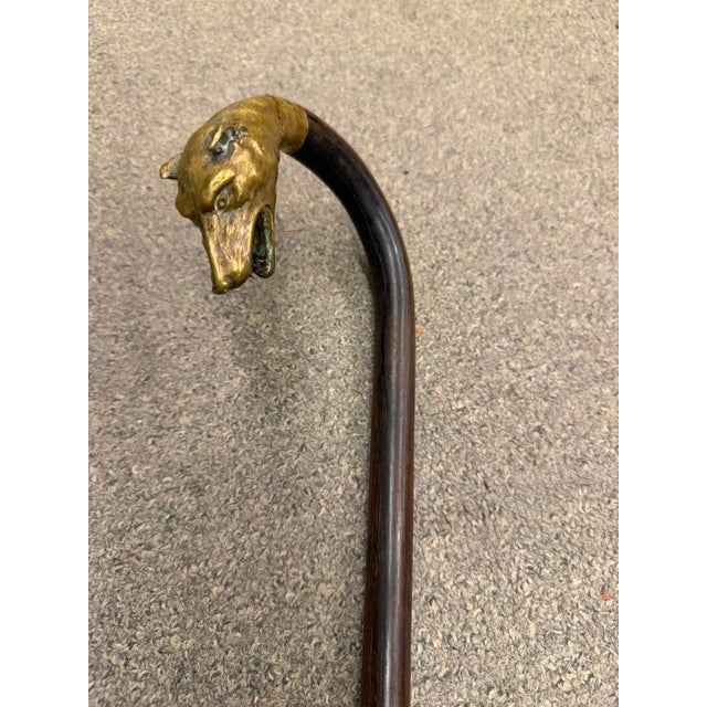 Striking 19th-century Spanish walking stick dating to circa 1870, featuring a beautifully shaped bent-wood shaft and an...