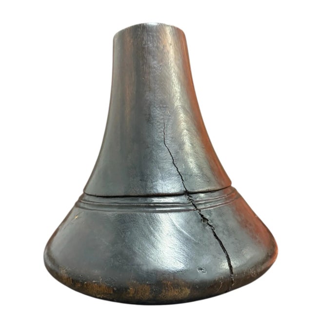 Carved wooden milk jug from the Tutsi or Hima people. Used for milk given to new mothers while preparing for childborth....