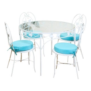 Vintage Wrought Iron Patio Dining Table With Leaf Motif Aqua Cushions and Glass Top For Sale