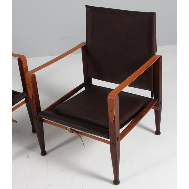Kaare Klint for Rud Rasmussen. Pair of Safari chairs new upholstered with mokka aniline leather. New straps of butt hide...