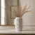 This mid-century Japanese Blanc de Chine reticulated Chinoiserie vase features a delicate lattice openwork design...