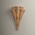 Airy and organic, the Arverne sconce lends breezy coastal style to any space. Two hand-woven wicker shades nest together...