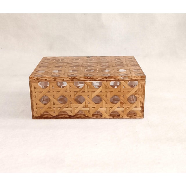 A collectible, luxury Christian Dior Home storage box from the 1980s. Rectangular box made of polished acrylic glass and...