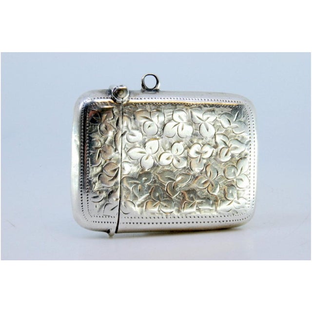 Silver Matchbox with Plant Motifs Surrounding Monogram Card and Hanging Ring, in Good conditions. Designed 1890 to 1919