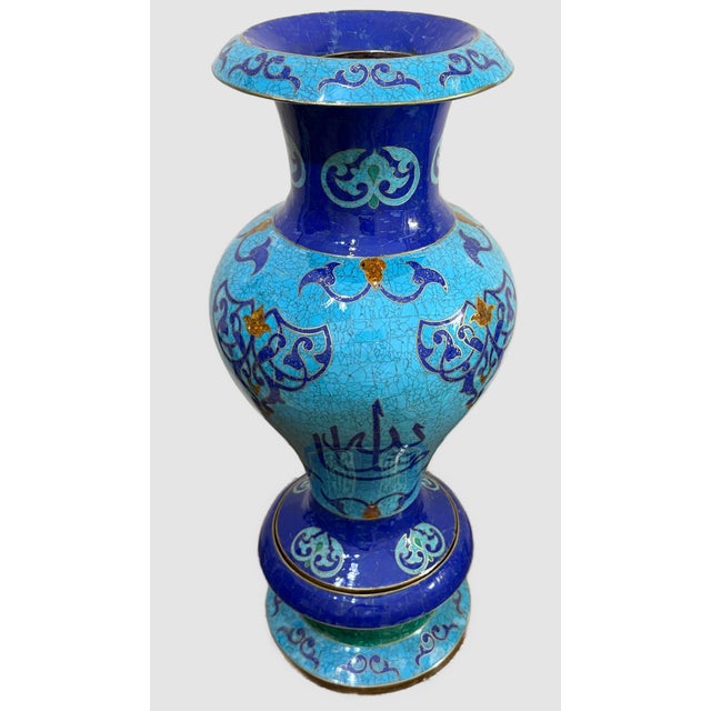 A striking handcrafted decorative vase featuring authentic Lapis Lazuli, Turquoise, and warm golden inlay accents,...