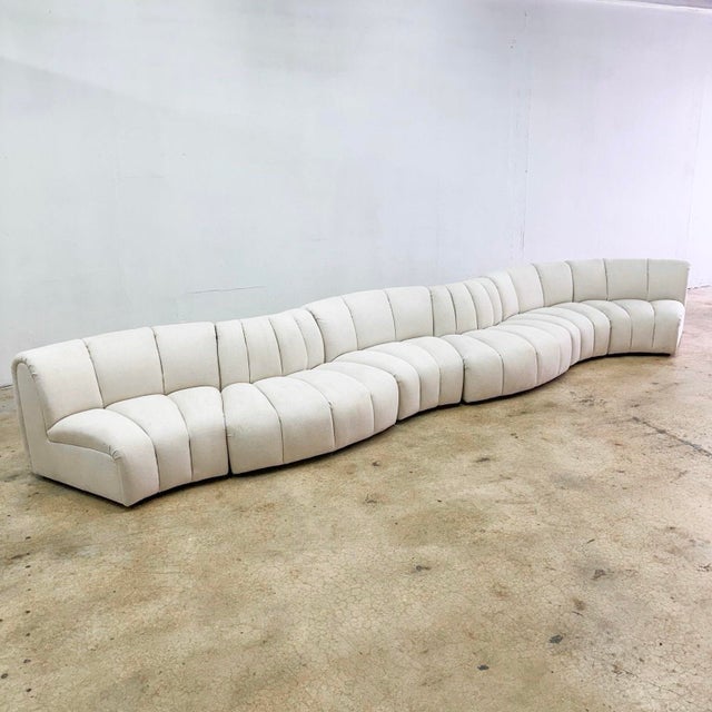 This striking postmodern sectional features 4 concave and 2 convex pieces, allowing for endless arrangements—from...