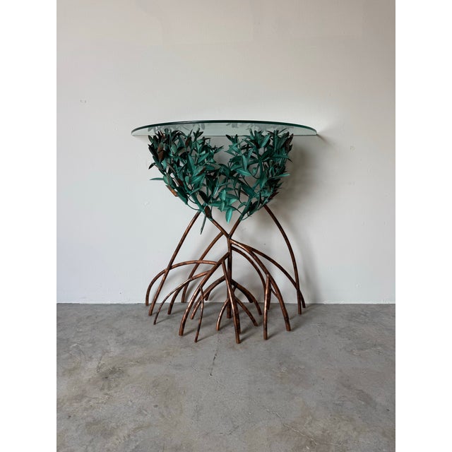 A striking and rare “Mangrove” sculptural console table by Lee and Sharon Jones, renowned for their nature-inspired metal...