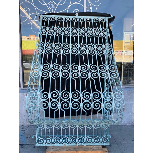 This is an incredible iron window grid. Monumental in size and beauty. It features a step out where it allows for sitting...
