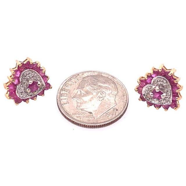 14 Karat Two Tone White and Yellow Gold Button Ruby earrings with Diamonds. 32 Round Rubies 2 Round Diamonds 2.6 grams...
