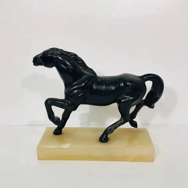 Very nice figure of a trotting black spelter horse standing proudly on a marble base. This figure dates back to the late...