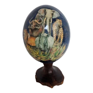 1980s Sherry Rowe Handmade Ostrich Egg Featuring African Wildlife Under Dark Blue Sky and Gold Leaf Stars