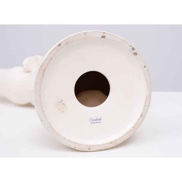 Lovely White Ceramic Elephant, balancing on a Gold color Ball . Manufactured by quality firm Goebel W Germany . 1970s This...