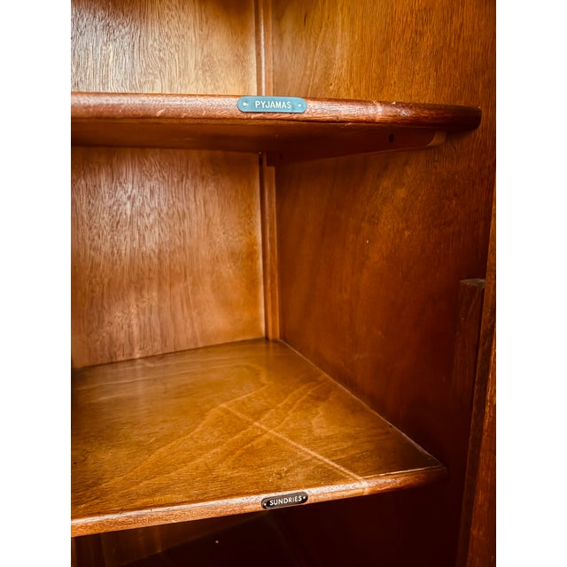 Unique and beautiful figured bookmatched walnut doors. Likely a Compactom or Compactom-system English gentleman’s wardrobe...