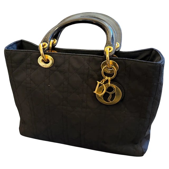 This is an excellent example of the iconic Lady Dior tote bag, a signature piece from Christian Dior, dating from the 21st...
