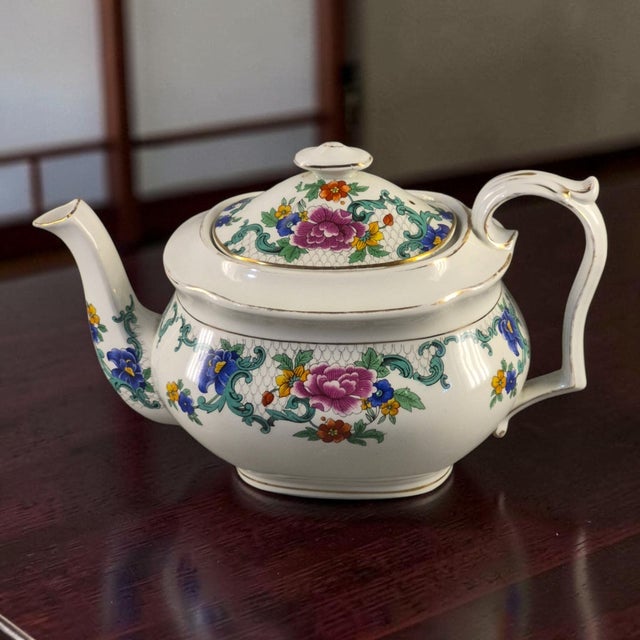 This vintage Booths England silicone china tea pot features a beautiful "Floradora" pattern with a multicolor floral...