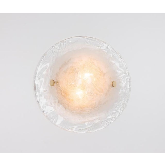 Set of wonderful mid-century wall sconces with a large glass piece on a metal frame, made by kalmar, austria, manufactured...