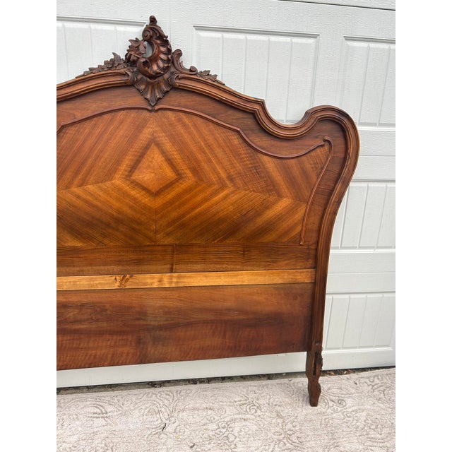 Antique (1890's) Full Size Headboard has a French Style. Carved & Shaped in a Brown Finish. The Wood is Walnut. This...
