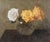 This painting features a delicate arrangement of three rosestwo vibrant yellow and one pure whiteset against a muted...