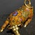 This striking vintage cloisonne enamel figurine depicts a powerful bull or ox in a dynamic, charging pose, a traditional...