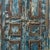 Armoire constructed from antique Indian teakwood doors and architectural elements, showcasing several worn layers of paint...