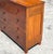 An exceptional vintage flame mahogany chest of drawers, masterfully crafted from richly figured hardwood and showcasing...