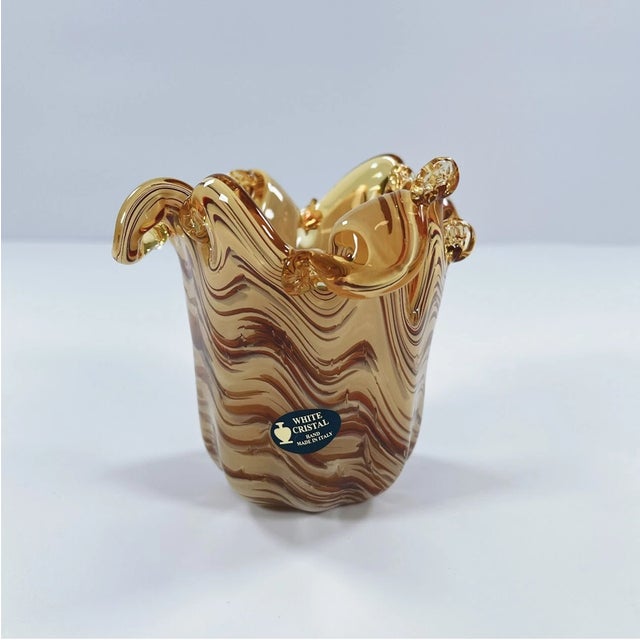 Elevate your space with this stunning Murano-style hand-blown art glass vase, inspired by the rich glassmaking heritage of...